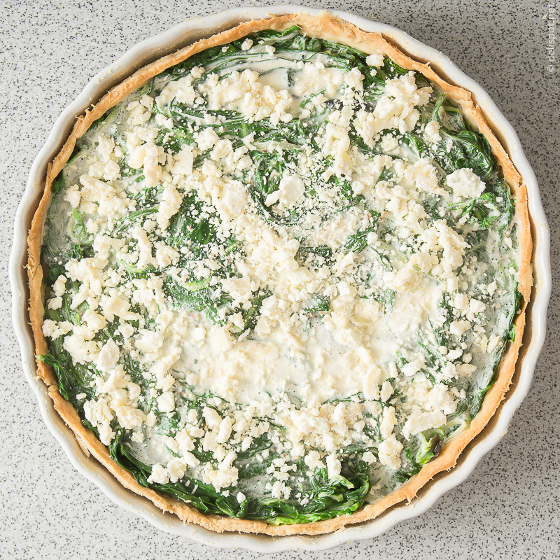 Quiche, Ziegenkäse darüber streuen